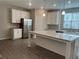 Modern kitchen with white cabinets, stainless steel appliances, and center island at 4589 Hawthorn Rose Ln, Buford, GA 30518