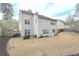 Large backyard featuring well-maintained landscaping and ample space for outdoor activities and entertaining at 5111 Olive Branch Cir, Powder Springs, GA 30127