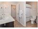 Bright bathroom featuring a double sink vanity, and a shower with white curtain at 5111 Olive Branch Cir, Powder Springs, GA 30127