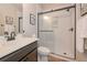 Modern bathroom featuring a sleek glass shower and stylish vanity with beautiful decorations at 5111 Olive Branch Cir, Powder Springs, GA 30127