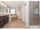 The bathroom features a vanity, a large mirror, a soaking tub, and a shower at 5111 Olive Branch Cir, Powder Springs, GA 30127