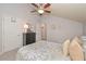 Bedroom with vaulted ceiling, decor, and a neatly made bed at 5111 Olive Branch Cir, Powder Springs, GA 30127