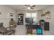Bright bedroom featuring a ceiling fan, neutral walls, and versatile space for an office setup at 5111 Olive Branch Cir, Powder Springs, GA 30127