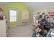 Bedroom with vaulted ceiling, neutral carpet, and a large window at 5111 Olive Branch Cir, Powder Springs, GA 30127