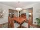 Open dining room with hardwood floors and contemporary lighting at 5111 Olive Branch Cir, Powder Springs, GA 30127