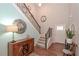 Elegant foyer with hardwood floors, staircase, and decorative lighting at 5111 Olive Branch Cir, Powder Springs, GA 30127