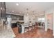 Kitchen with dark cabinets, stainless steel appliances, granite countertops, and seating at island at 5111 Olive Branch Cir, Powder Springs, GA 30127
