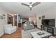Comfortable living room with hardwood floors that opens up to the kitchen at 5111 Olive Branch Cir, Powder Springs, GA 30127