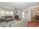 Inviting living room with hardwood floors, fireplace, and natural light at 5111 Olive Branch Cir, Powder Springs, GA 30127
