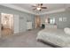 Spacious main bedroom features a tray ceiling, and ensuite bathroom at 5111 Olive Branch Cir, Powder Springs, GA 30127