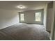 Large bedroom with new neutral carpet, ample natural light, and closet at 517 Whitley Dr, Forest Park, GA 30297