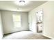 Neutral bedroom with new carpet, closet, and adjoins a bathroom with dual sinks and updated fixtures at 517 Whitley Dr, Forest Park, GA 30297