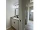 Stylish half bathroom features granite countertop, white vanity, and updated fixtures at 517 Whitley Dr, Forest Park, GA 30297