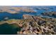 Panoramic aerial view showcasing the property's location amongst lakes and mature trees at 6925 Lighthouse Point, Cumming, GA 30041