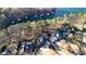 Aerial view showcasing luxury homes, lush greenery, and waterfront living creating a picturesque and serene neighborhood at 6925 Lighthouse Point, Cumming, GA 30041