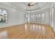 Spacious bedroom featuring hardwood floors, tray ceilings, recessed lighting, and large windows at 6925 Lighthouse Point, Cumming, GA 30041