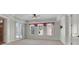 A bright bedroom is accented with transom windows and decorative valances at 6925 Lighthouse Point, Cumming, GA 30041