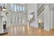 Bright living room with a fireplace, built-in bookshelves, and large windows that flood the space with natural light at 6925 Lighthouse Point, Cumming, GA 30041