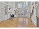 Bright living room with a fireplace, built-in bookshelves, and large windows that flood the space with natural light at 6925 Lighthouse Point, Cumming, GA 30041