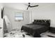 Modern bedroom with black and gold accents, sleek furniture and a large window at 1500 Tara Pl # 709, Hampton, GA 30228