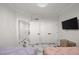 This bedroom features neutral walls, crown molding, television, a storage cabinet, and two closets at 1500 Tara Pl # 709, Hampton, GA 30228