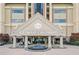 A grand entrance of 1500 Tara Place Condominiums featuring a water fountain and manicured landscaping at 1500 Tara Pl # 709, Hampton, GA 30228