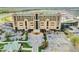 Expansive exterior view showcasing a modern condominium and surrounding parking area near the racetrack at 1500 Tara Pl # 709, Hampton, GA 30228