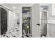 Hallway includes stainless steel refrigerator, stackable washer/dryer, and storage in a well-lit, stylish space at 1500 Tara Pl # 709, Hampton, GA 30228