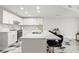Contemporary kitchen with a center island, marble countertops, and modern light fixtures at 1500 Tara Pl # 709, Hampton, GA 30228