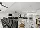 Large recreation room featuring row seating, a kitchen, a TV, and expansive views of the racetrack at 1500 Tara Pl # 709, Hampton, GA 30228