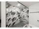 This glass shower boasts marble-style tile, black hardware, built-in shelving, and a convenient shower bench at 1500 Tara Pl # 709, Hampton, GA 30228
