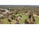 Overhead view showcases a large property surrounded by trees, with residential structures visible at 300 Smith Ave, Bowdon, GA 30108
