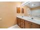 Bathroom with a double sink vanity, blinds and a large mirror at 300 Smith Ave, Bowdon, GA 30108