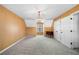Bedroom with carpet, chandelier, closet and window at 300 Smith Ave, Bowdon, GA 30108