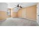 Spacious bedroom with neutral carpet, ceiling fan, and dormer window at 300 Smith Ave, Bowdon, GA 30108