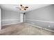 Bedroom featuring neutral carpet, a ceiling fan, and plenty of space at 300 Smith Ave, Bowdon, GA 30108