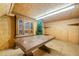Bonus room with wooden walls, hutch, table and shelves at 300 Smith Ave, Bowdon, GA 30108