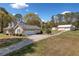 Exterior view of house, garage, driveway and shed at 300 Smith Ave, Bowdon, GA 30108