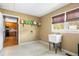 Laundry room featuring a utility sink and a view into the kitchen at 300 Smith Ave, Bowdon, GA 30108