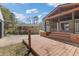 Backyard with spacious deck, screened porch, and steps leading to a fenced-in yard at 6414 Bimini Dr, Forest Park, GA 30297