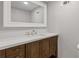 Bathroom showcasing a vanity with dark cabinets and a light countertop at 6414 Bimini Dr, Forest Park, GA 30297
