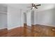 Open bedroom layout with hardwood floors, fan and a large closet at 6414 Bimini Dr, Forest Park, GA 30297