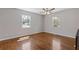 Sunlit bedroom with hardwood floors, neutral walls, and large windows offering a serene retreat at 6414 Bimini Dr, Forest Park, GA 30297