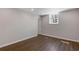 A bright, open room featuring laminate flooring, white trim, and modern lighting at 6414 Bimini Dr, Forest Park, GA 30297