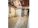 Unfinished basement space with exposed insulation and concrete walls at 717 Farmstead Rd, Suwanee, GA 30024