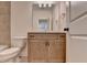 Bathroom vanity with drawers and cabinets, plus a large mirror at 717 Farmstead Rd, Suwanee, GA 30024