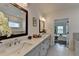 Bright bathroom features double sinks, quartz counters, with a tile floor at 717 Farmstead Rd, Suwanee, GA 30024