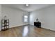 This bedroom features hardwood floors and a window at 717 Farmstead Rd, Suwanee, GA 30024