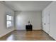 This bedroom features hardwood floors, a window, and closet at 717 Farmstead Rd, Suwanee, GA 30024