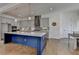 Modern kitchen with gray cabinets, stainless steel appliances, and a large island at 717 Farmstead Rd, Suwanee, GA 30024